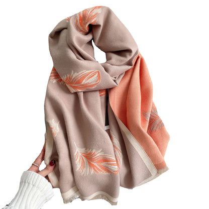 Scarf with floral pattern draped over a white surface